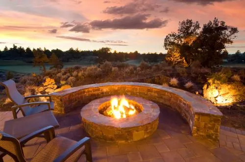 Stone fire pit outdoor living space in Ashland PA by KDI Hardscapes